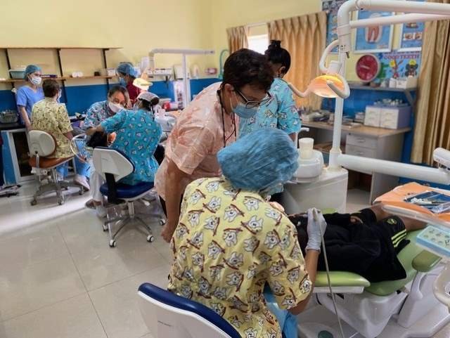 Volunteers treating patients in the Sihanoukville dental clinic, Cambodia