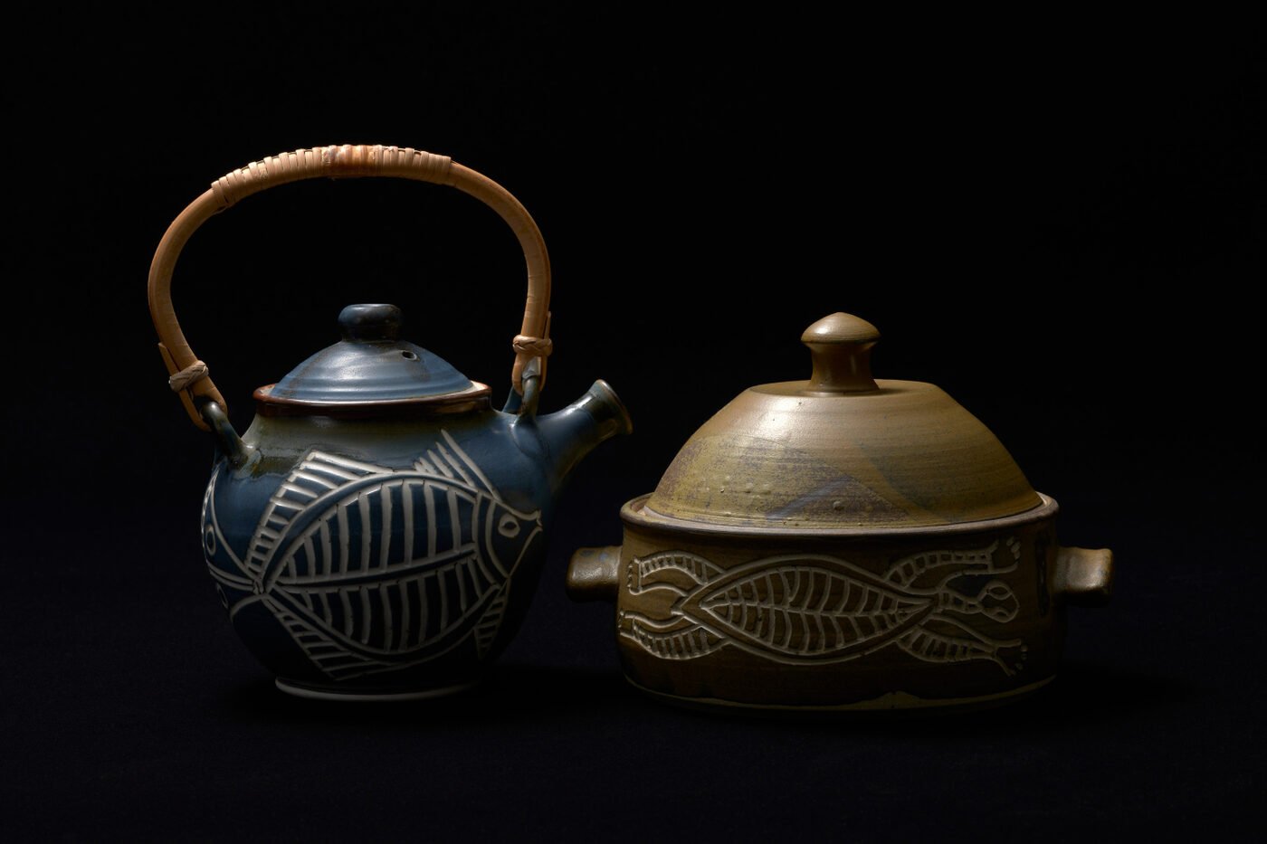 Contemporary studio vessels with incised fish motifs