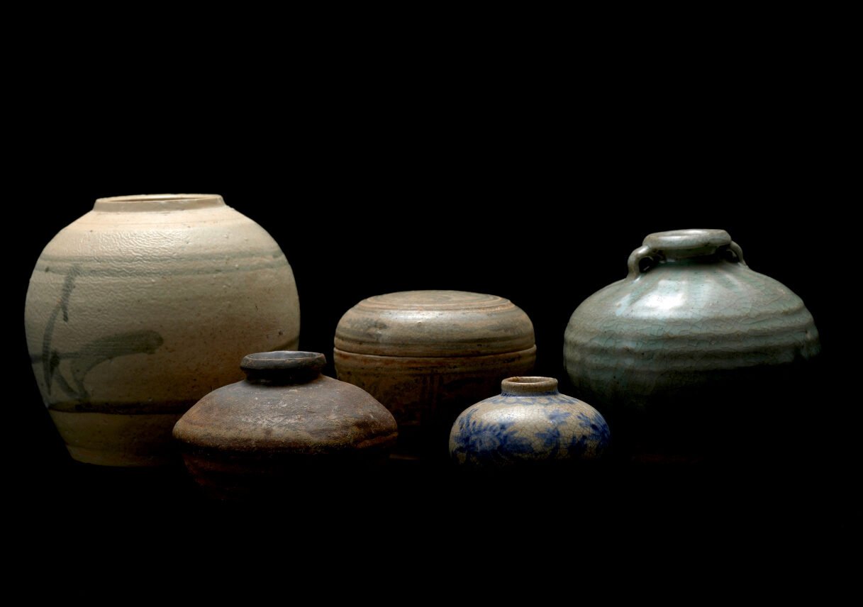 A grouping of historic glazed stoneware jars from the museum&rsquo;s ceramics collection