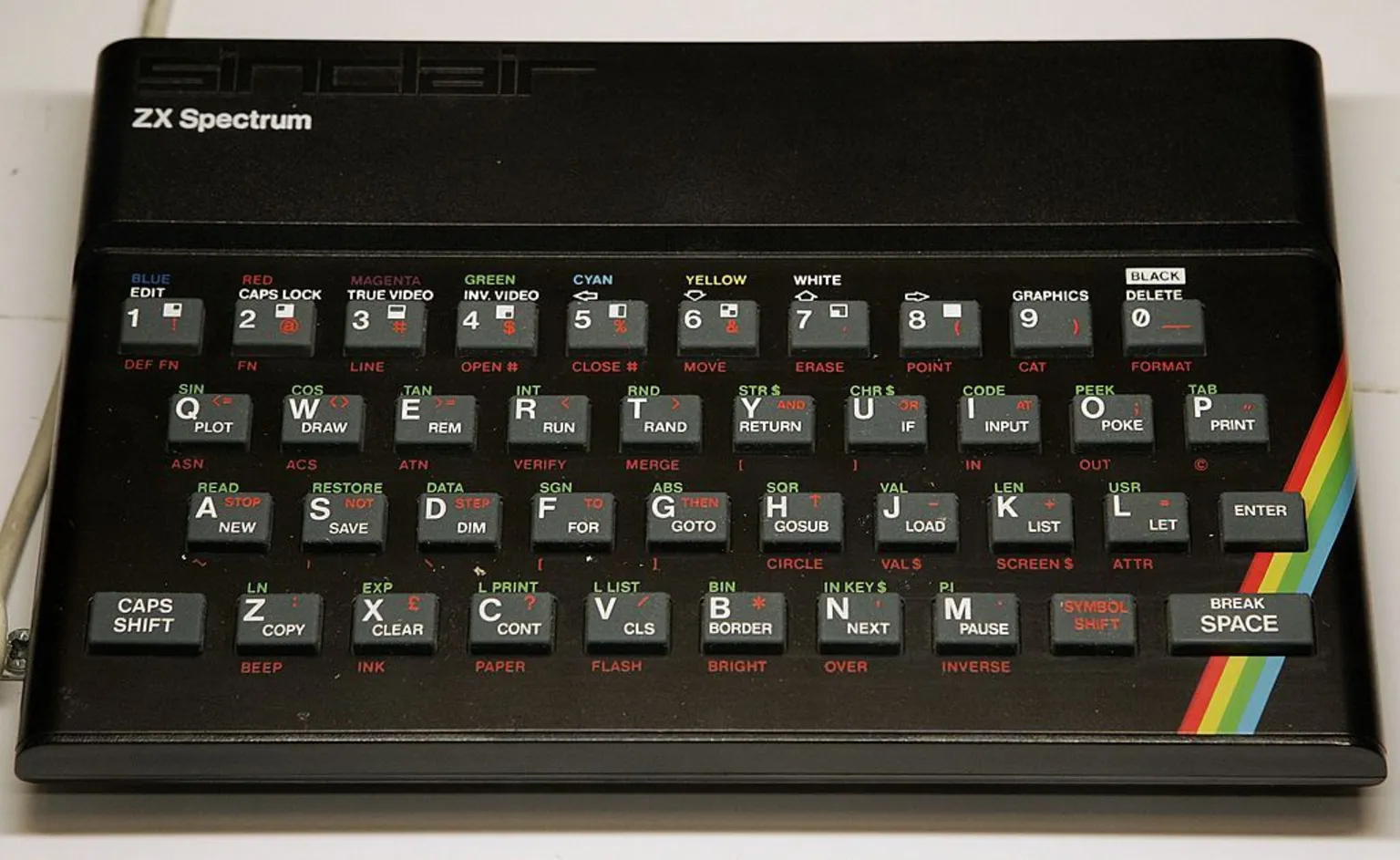 A Sinclair ZX Spectrum home computer with its rainbow-striped keyboard